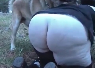 Hardcore fuck with a dog outdoors